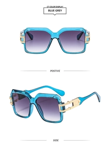 Detail of square blue sunglasses with purple gradient lenses and gold metal temples