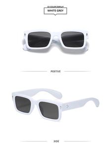Detail view of white square frame sunglasses with silver diamond rivets and dark grey lenses