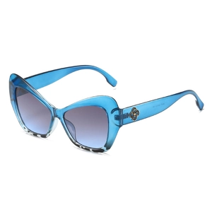 Stylish cat-eye sunglasses with blue resin frames, leopard accents and gradient blue lenses