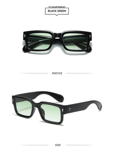 Detail view of square black sunglasses with light green lenses and metal arrow on temples