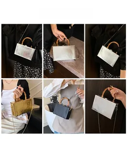Detail view of box clutches with bamboo handles and chain straps in multiple carry styles