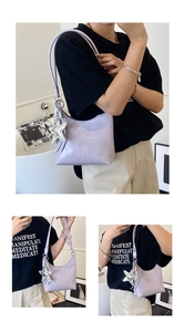 Détail du sac hobo lavande avec texture cuir vintage et pendentif étoile argenté brillant