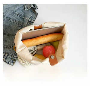 Macro view of woven tote bag interior showing large capacity with magnetic buckle