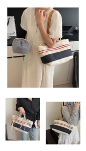 Detail view of canvas tote bag with red and blue stripes and a separate inner drawstring pouch