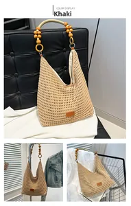 Detail of khaki hand-woven tote bag showing wooden bead handles and hollow knit texture