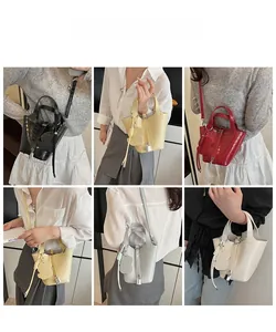 Mini crocodile pattern handbags in various colors displayed with a bear charm on a model