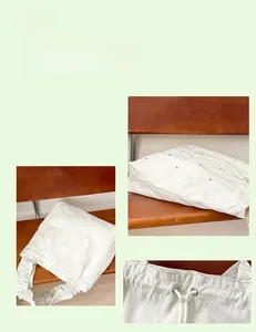 Detail of white nylon tote with drawstring closure and ruched cloud shoulder strap