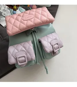 Detail of mint green quilted mini backpack with macrame pearls and drawstrings