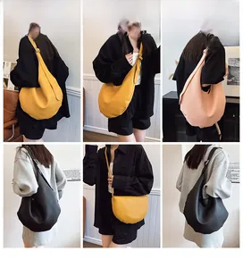 Detail view of large lychee texture bucket bag with adjustable strap in three colors