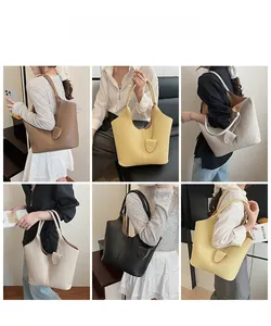Collection of soft leather bucket bags in five colors shown on model for style reference
