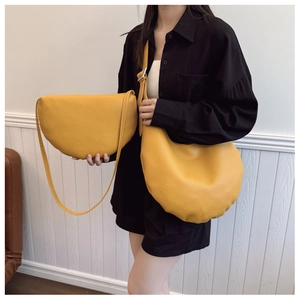 Ginger yellow bucket bags in large and small sizes with litchi grain texture