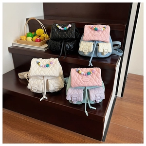 Quilted mini backpacks in vibrant macaron colors featuring decorative pearl handles