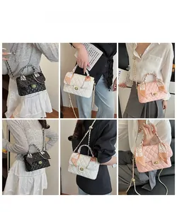 Close-up of quilted pattern bags with silk scarf handles and elegant chain straps