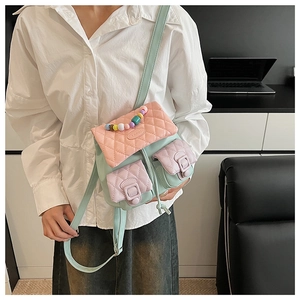 Detail shot of multi-color quilted mini backpack with beaded accents and pastel leather straps