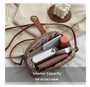 Detail showing internal capacity of straw saddle bag with floral lining and essentials
