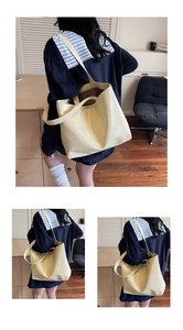 Detail of light yellow crocodile pattern tote bag with large capacity and striped lining