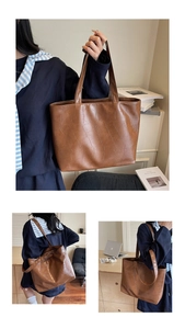 Detail of brown crocodile pattern tote bag with polished PU leather and large capacity