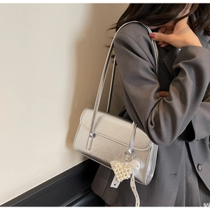 Silver metallic wrinkled shoulder bag with a pearl heart charm and lace ribbons detail