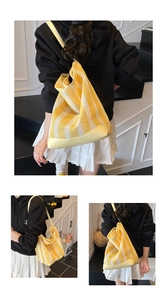 Detail of yellow and white striped mesh tote bag featuring breathable mesh and reinforced base