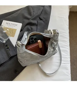 Interior view of silver rhinestone croissant bag showing space for phone and wallet