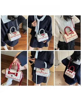 Model wearing a sweet Boston bag with bow details and ruffles in red and light blue colors