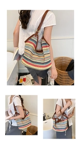 Detail of colorful striped woven tote bag with brown leather handles and large capacity