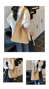 Detail of the woven texture and wide shoulder strap on the handmade straw tote bag