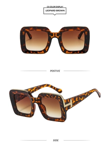 Detail of leopard brown square sunglasses with T-shaped gold metal inlay and gradient lens