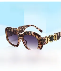 Close-up of tortoiseshell frames with gold decorative accents and gradient lenses