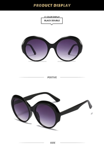 Vues de face et de profil de lunettes de soleil rondes noires avec verres dégradés