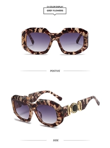 Front and side views of grey floral acetate sunglasses with gold metal ring detail