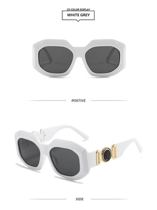 Detail view of white square frame sunglasses with grey lenses and gold accents