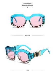 Detail view of stylish square sunglasses with blue leopard frames and gold metal hinge accents
