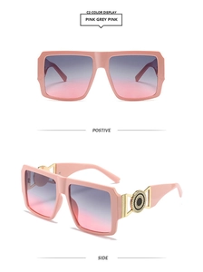 Detail of pink square sunglasses featuring golden metal accents and gradient lenses