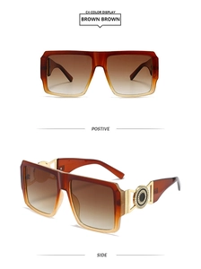 Detail view of square oversized sunglasses with brown gradient frames and gold metal temples