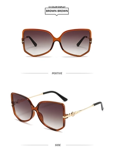 Detail of luxury butterfly frame sunglasses with gold hollowed metal temples and gradient lenses