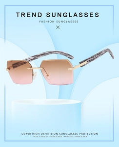 Detail of UV400 rimless sunglasses with gradient lenses and wood grain temple arms