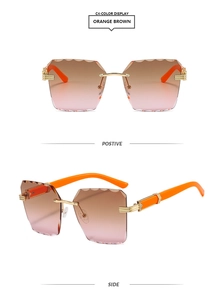 Detail of rimless sunglasses with orange brown gradient lenses and wave cut edges