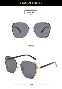 Detail of square semi-rimless sunglasses with gold filigree mesh hollow temples