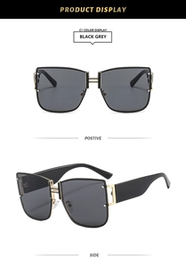 Detailed view of fashion square sunglasses with H-shaped gold bridge and rivet accents