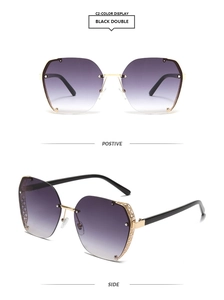 Detail of square gold metal frame sunglasses with gradient lenses and cut-out temples