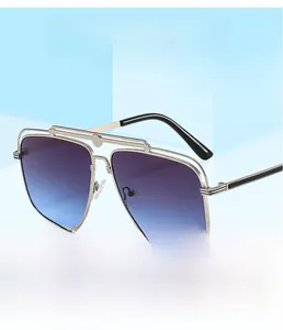 Detail view of aviator sunglasses with metal double bridge and blue purple gradient lenses