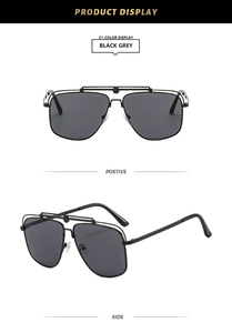 Detail of aviator sunglasses with black metal frame, double bridge and side hollow design