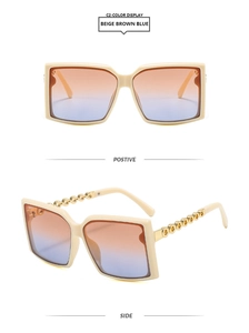 Detail of square beige sunglasses with gradient lenses and golden chain link temples