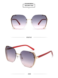 Detail of red and gold square half-frame sunglasses with purple gradient lenses and mesh