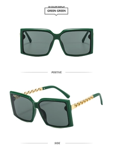 Detail view of square green sunglasses featuring elegant gold chain-link metal temples