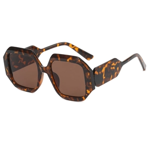 Fashionable geometric tortoise shell sunglasses with retro brown lenses and wavy temples