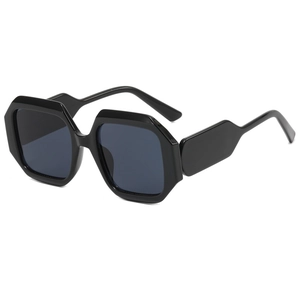 Fashionable black polygonal oversized sunglasses with dark grey lenses in a retro chic style