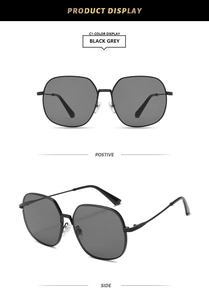 Macro view of square vintage metal sunglasses with black grey lenses and clear nose pads