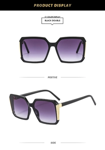 Detail of square sunglasses in black double color with purple gradient lenses and gold accents